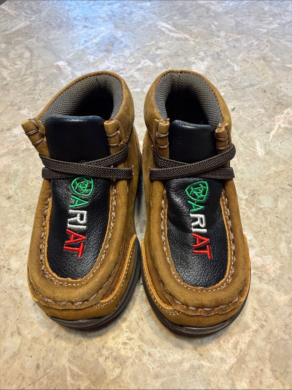 Ariat Kids Suede Moccasins in Brown with Black Inlay